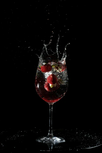 a glass of wine with a strawberry splashing out of it, a digital rendering, pexels, renaissance, sparkling water, squashed berries, on a black background, hero shot