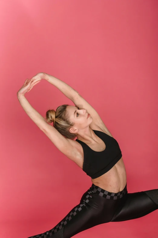 a woman in black leo leo leo leo leo leo leo leo leo leo leo leo leo leo, by Rachel Reckitt, trending on pexels, arabesque, cropped red yoga short, pose(arms up + happy), pink arches, with abs