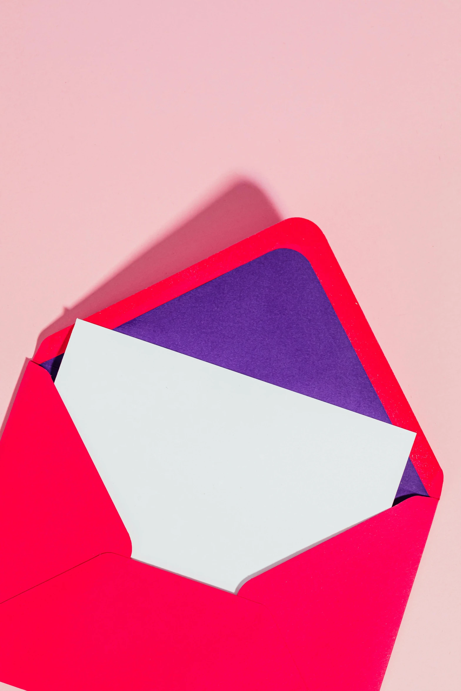 a red envelope with a piece of paper sticking out of it, pexels contest winner, letterism, pink and purple, color block, square, email