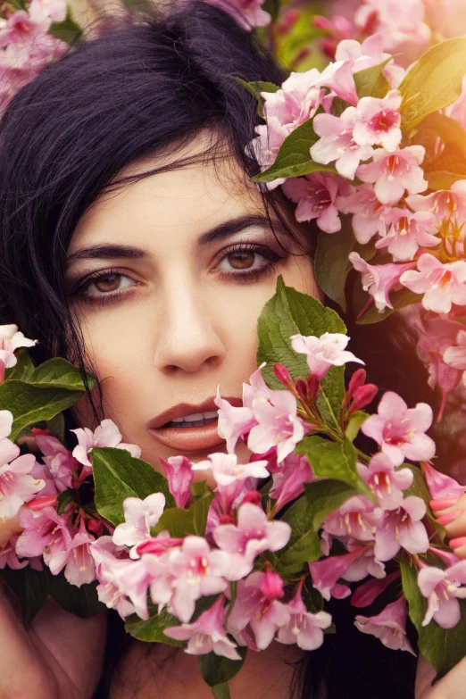 a woman with flowers in her hair, an album cover, inspired by Elsa Bleda, trending on pexels, black hair and large eyes, spring season, beauty filter, vine