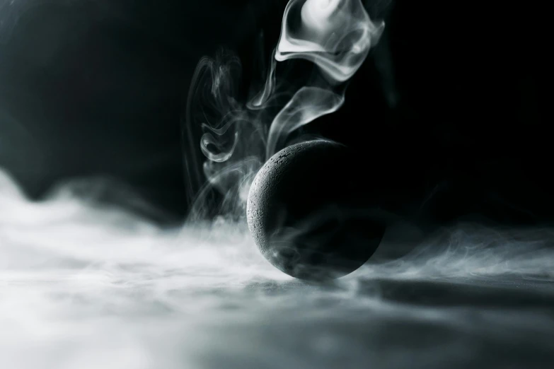 a close up of a tennis ball with smoke coming out of it, inspired by Anton Solomoukha, moonlit, black mist, from arcane, dramatic product shot