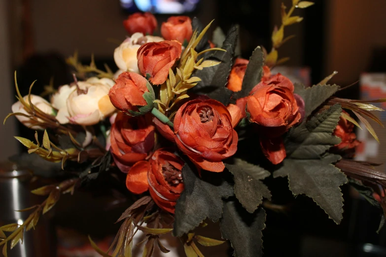 a close up of a vase of flowers on a table, at night, orange and brown leaves for hair, set photo, illustration »