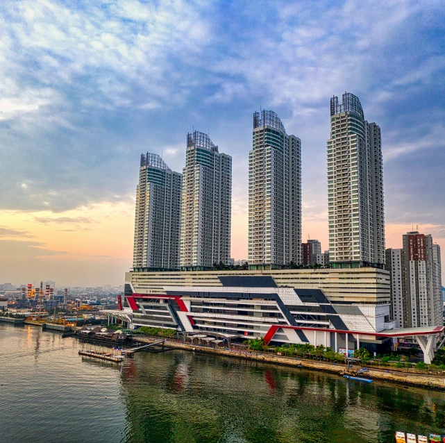 a river running through a city next to tall buildings, by Bernardino Mei, pexels contest winner, hyperrealism, three towers, asia, on ship, thumbnail