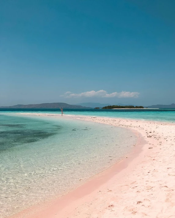 a large body of water next to a sandy beach, pink, philippines, instagram photo, thumbnail