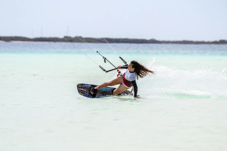 a woman windsurfing in the ocean on a sunny day, by Bertram Brooker, pexels contest winner, hurufiyya, varadero beach, kites, lagoon, instagram post