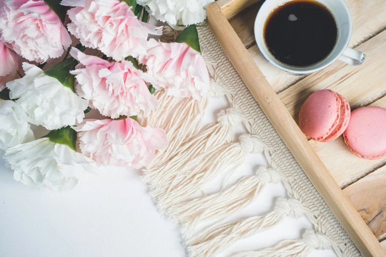 a tray with two macarons and a cup of coffee, by Sylvia Wishart, pexels contest winner, macrame, easter, carnation, background image