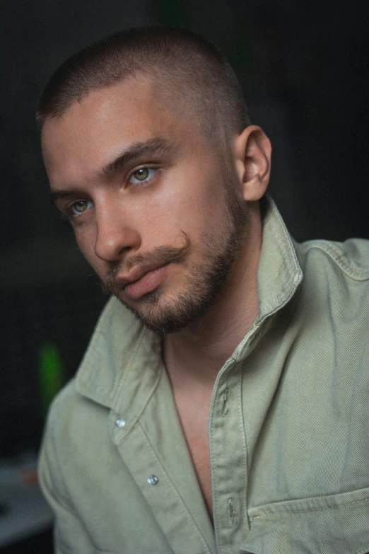 a close up of a person wearing a shirt, a character portrait, reddit, shaven stubble, color photo, dasha taran, masculine