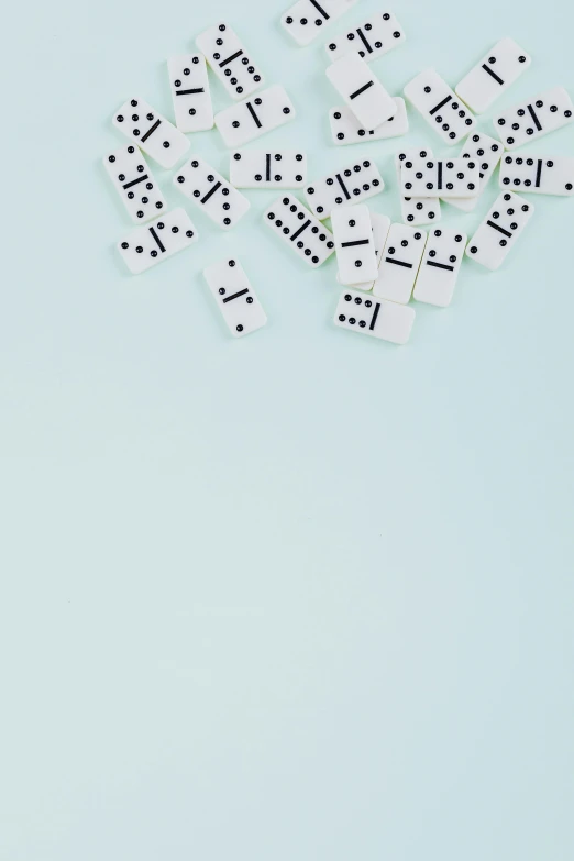 a group of domino pieces laying on top of each other, an album cover, by Emma Andijewska, unsplash, ffffound, minimalist wallpaper, poker, light blues