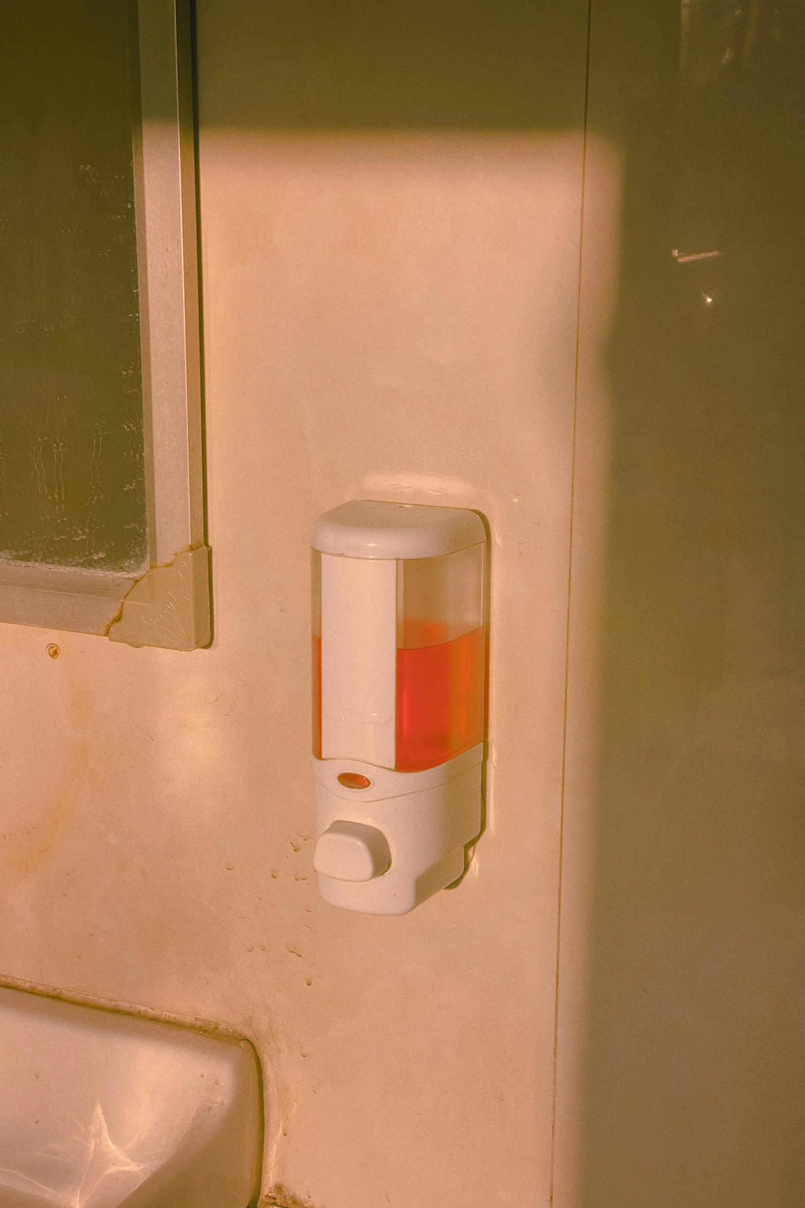a bathroom with a sink, mirror and soap dispenser, an album cover, inspired by Elsa Bleda, unsplash, redscale photography, square, 1 9 9 7, ignant