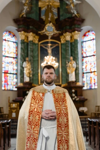 a man in a priest's robes standing in a church, an album cover, inspired by Barthélemy d'Eyck, shutterstock, full frontal portrait, 15081959 21121991 01012000 4k, norwegian man, photographed for reuters