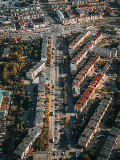 an aerial view of a city with lots of buildings, by Adam Marczyński, pexels contest winner, happening, suburbia street, russian architecture, ground angle uhd 8 k, taken on iphone 14 pro