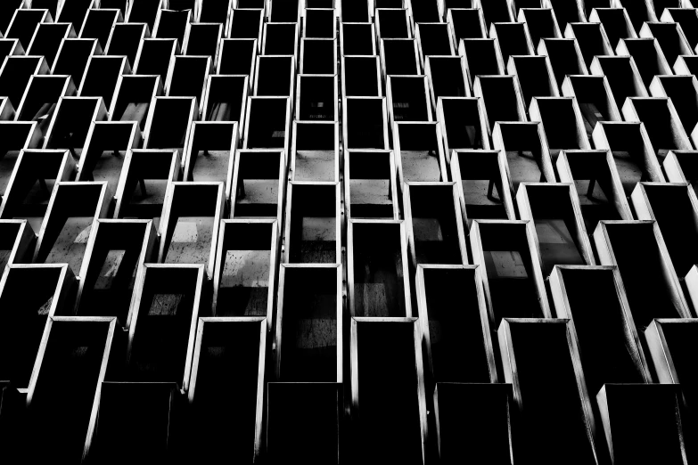 a black and white photo of a building, inspired by Donald Judd, unsplash, brutalism, ffffound, cubicles, tokio, ossuary