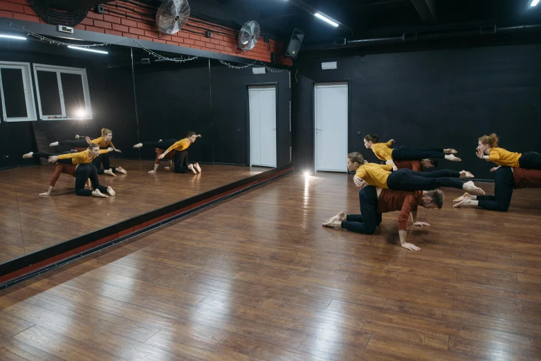 a group of dancers performing in a dance studio, by Emma Andijewska, full body 8k, фото девушка курит, flattened, actual photo