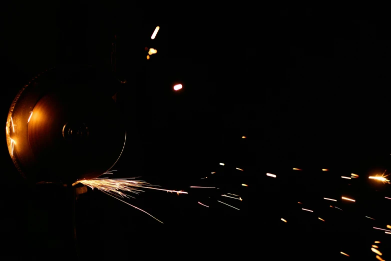 a person holding a sparkler in the dark, an album cover, by Jan Rustem, process art, welding torches for arms, 1 9 8 5 photograph, [ metal ], candid photograph