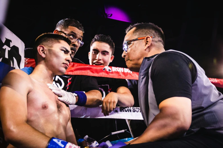 a group of men standing next to each other in a boxing ring, by Robbie Trevino, profile image, concert photo, getting ready to fight, david marquez