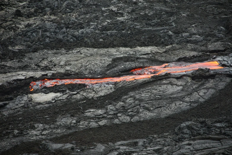 a close up of a lava flow on a mountain, by Alison Geissler, fan favorite, top - down photograph, long, photographed for reuters