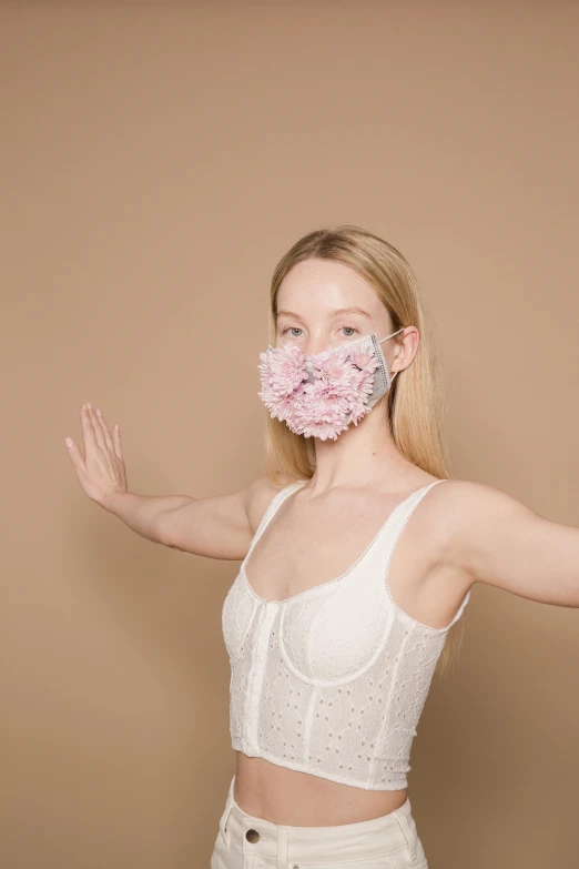 a woman with a pink flower in her mouth, by Nina Hamnett, happening, face mask, dressed in a frilly ((lace)), full product shot, gemma chen