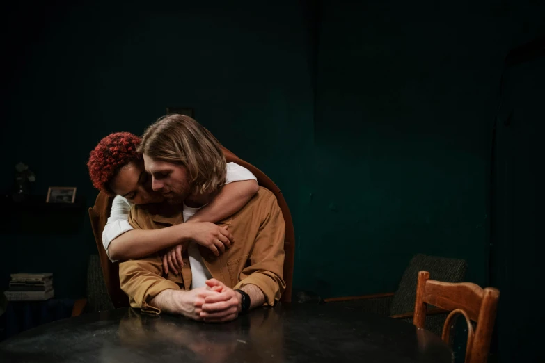 a man and a woman sitting at a table, by Elsa Bleda, trending on pexels, renaissance, hugging, felix englund, diverse, sitting on a mocha-colored table