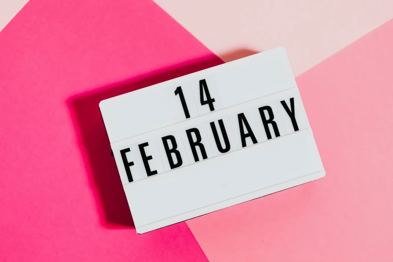 a sign that says 14th february on a pink and pink background, trending on pexels, happening, light box, lunar time, a wooden, non-binary