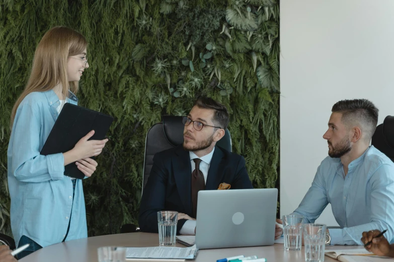 a group of people sitting around a table with laptops, by Adam Marczyński, pexels contest winner, standing on a desk, biophilia mood, business meeting, avatar image