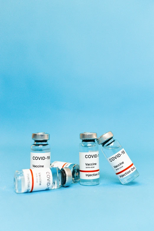 a group of three vials sitting next to each other, thumbnail, covid, label, featured