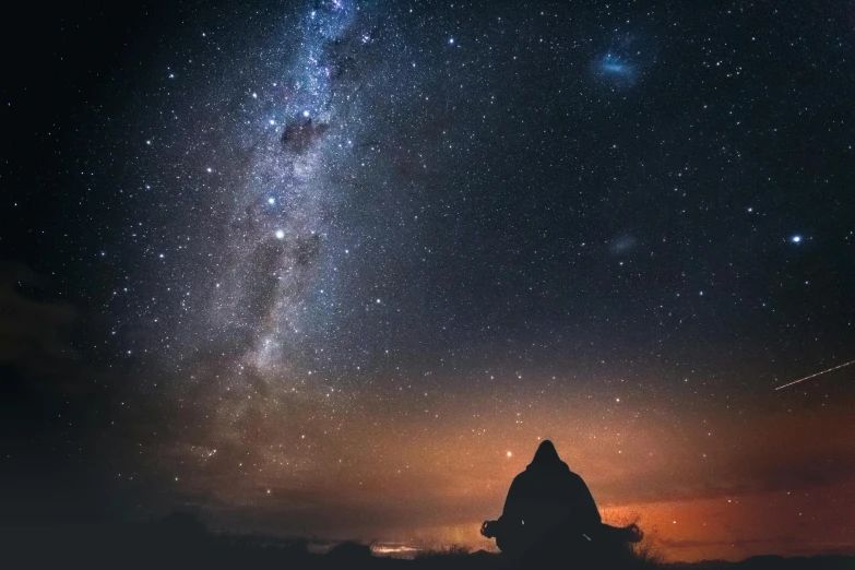 a person sitting on a rock looking at the night sky, pexels contest winner, light and space, esoteric equation heaven, southern cross, andromeda, galaxy reflected in helmet