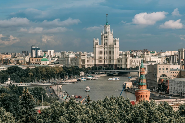 a view of a city from the top of a hill, an album cover, by Julia Pishtar, pexels contest winner, socialist realism, building along a river, joseph stalin, 000 — википедия, skyline showing