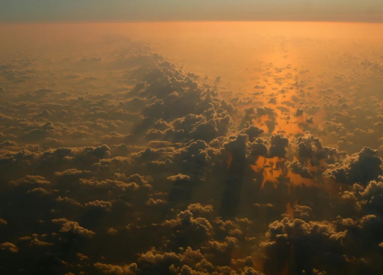 the sun is shining through the clouds in the sky, pexels contest winner, romanticism, aerial spaces, orange fog, “puffy cloudscape, over the horizon