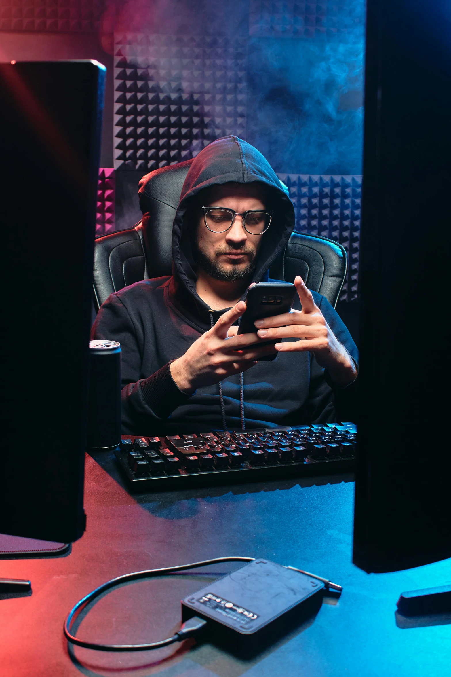 a man sitting in front of a computer monitor, mobile game, black hoodie techie, taken in 2 0 2 0, phone quality