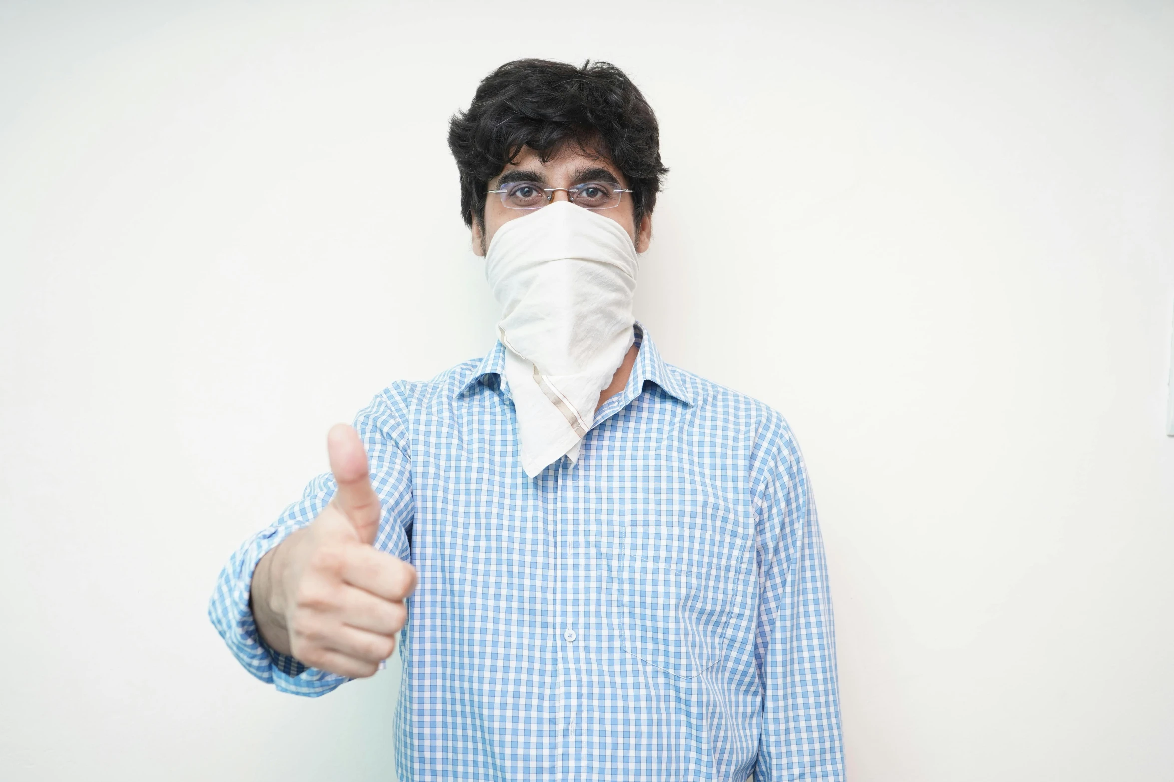 a man wearing a face mask giving a thumbs up, by Daniel Lieske, on a pale background, medicine, dressed in a worn, 1x