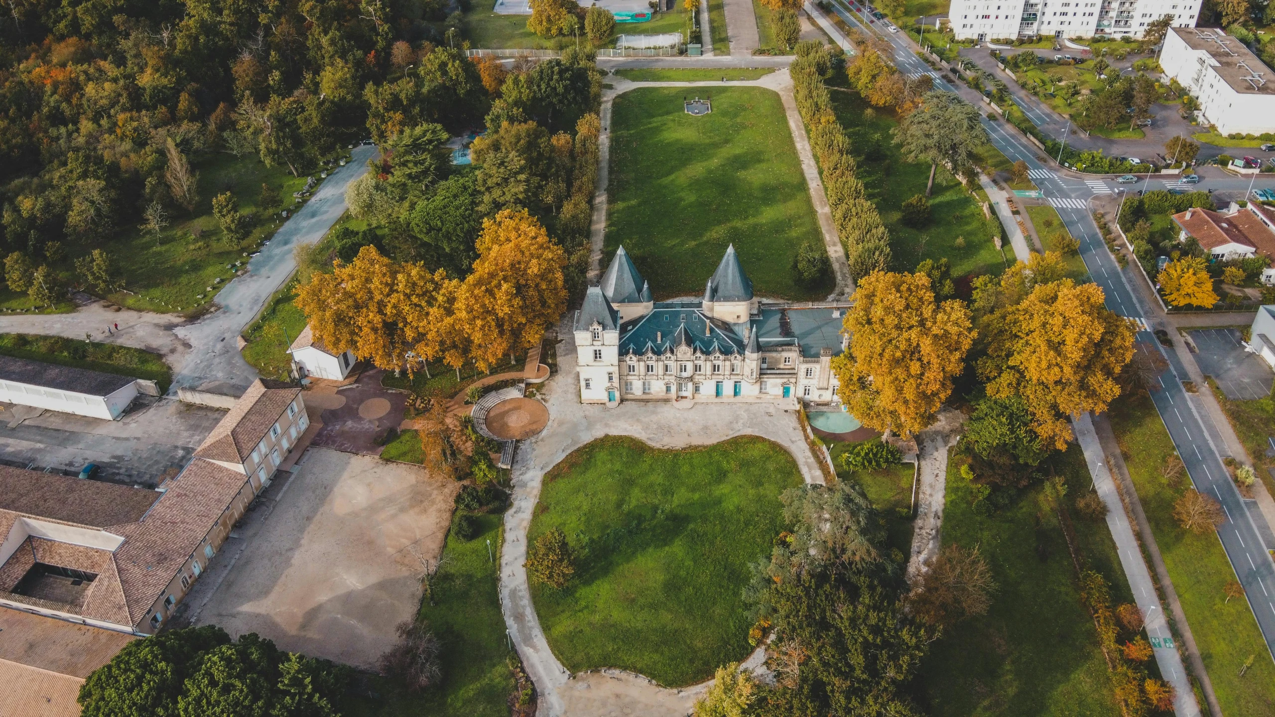 an aerial view of a castle surrounded by trees, pexels contest winner, art nouveau, alexander abdulov, thumbnail, outdoor photo, luxurious