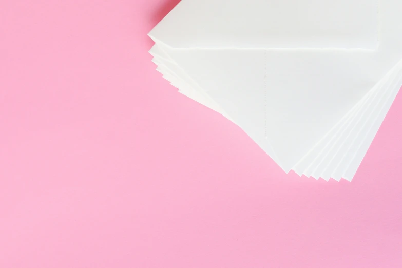 a pile of white paper sitting on top of a pink surface, email, background image, beautiful aesthetic, thumbnail