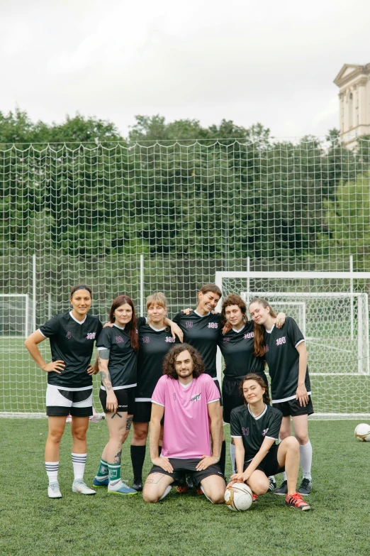 a group of young women standing on top of a soccer field, dasha taran, transgender, pink tigers, orthodox