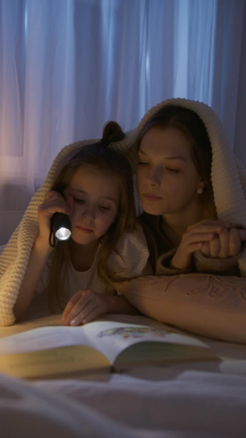 a mother and daughter reading a book under a blanket, shutterstock, flashlight lighting, instagram picture, ilustration, high quality screenshot