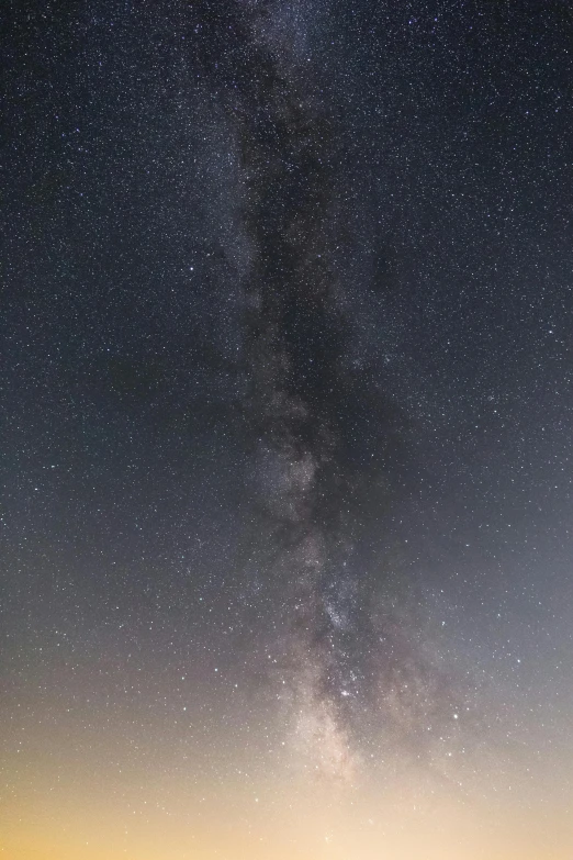 a sky filled with lots of stars next to a body of water, the milk way up above, panorama, atmospheric dust, matt howarth