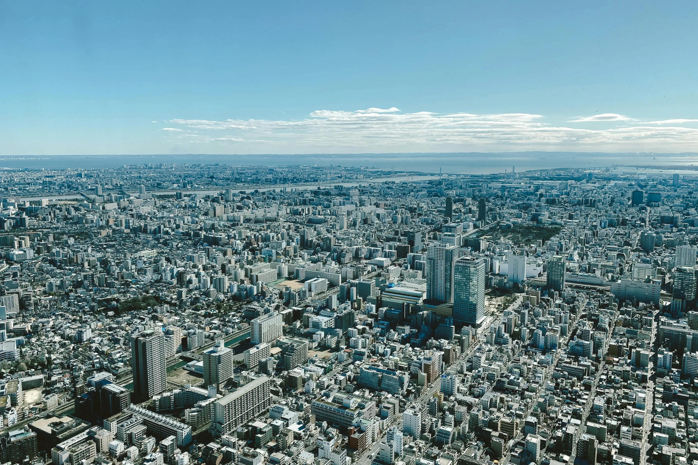 a large city filled with lots of tall buildings, unsplash, sōsaku hanga, blue sky, highly detailed high resolution, slide show, dezeen