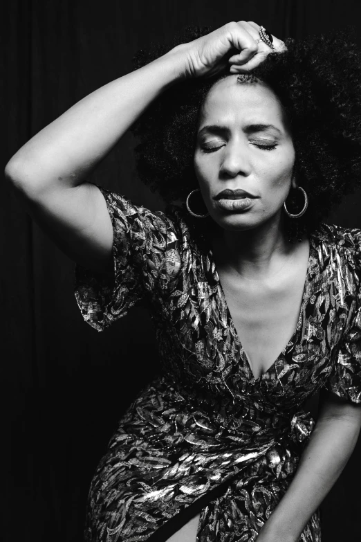 a black and white photo of a woman in a dress, afro, expressive pose, square, sweating