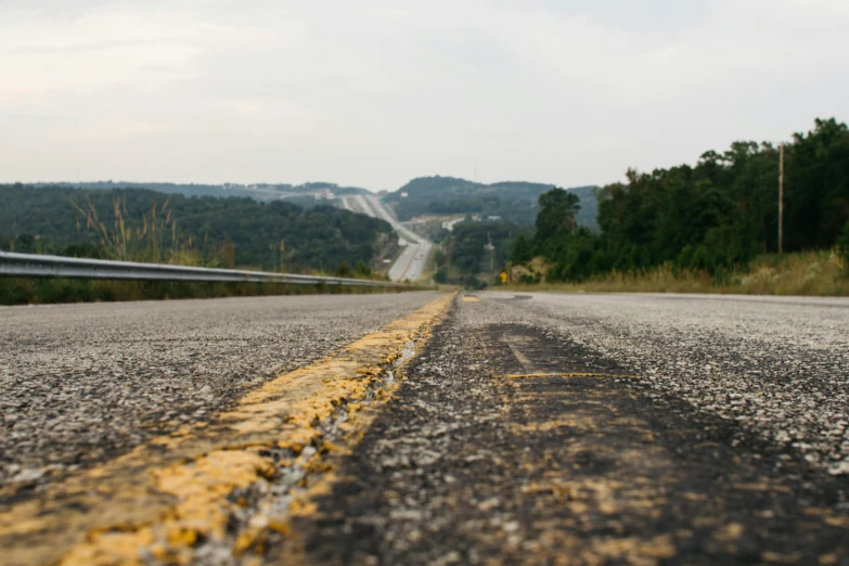 a road with a yellow line in the middle of it, an album cover, unsplash, renaissance, looking over west virginia, tx, 2 5 6 x 2 5 6 pixels, chalk