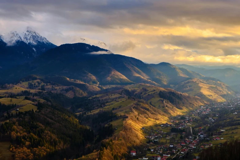 a view of a valley with mountains in the background, by Koloman Sokol, pexels contest winner, renaissance, dramatic afternoon lighting, romanian heritage, slide show, thumbnail