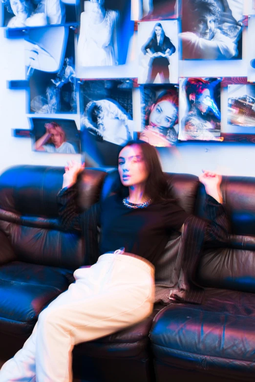 a woman sitting on a couch in a living room, an album cover, inspired by Nan Goldin, unsplash, visual art, dua lipa, annoyed, in a spaceship, androgynous person