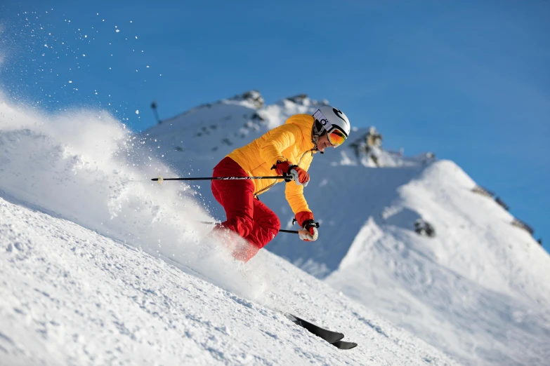 a man riding skis down the side of a snow covered slope, pexels contest winner, manuka, cinnabar, full colour, exterior shot