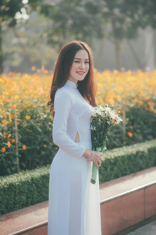 a woman in a white dress holding a bouquet of flowers, inspired by Ruth Jên, pexels contest winner, happening, ao dai, square, 1 8 yo, long sleeves
