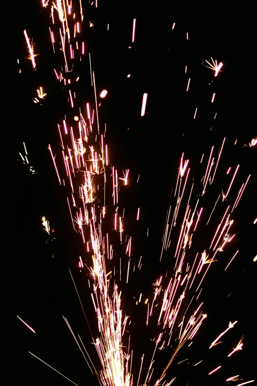 a firework is lit up in the dark, by Joe Stefanelli, happening, some chaotic sparkles, low quality photo, cut