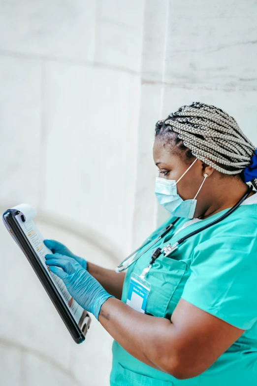 a woman with a stethoscope holding a clipboard, a picture, by Meredith Dillman, pexels contest winner, happening, photo of a black woman, nurse scrubs, technologies, profile image