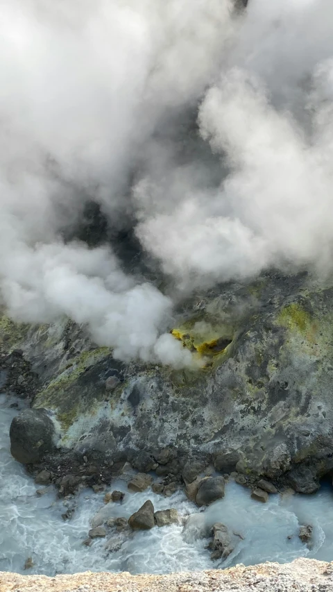 a large body of water with steam coming out of it, by Daren Bader, pexels contest winner, hurufiyya, sulfur, seen from above, mount doom, male and female