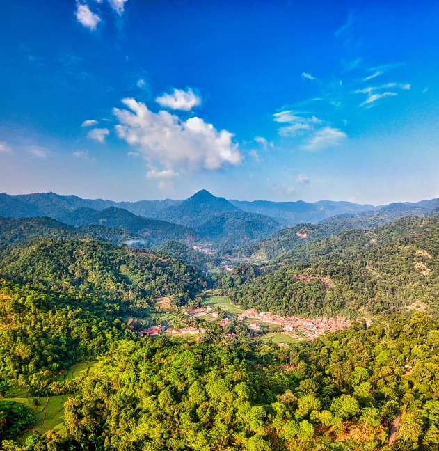 a view of the mountains from the top of a hill, by Daren Bader, pexels contest winner, sumatraism, lush forest in valley below, thumbnail, wide angle shot 4 k hdr, kuala lumpur