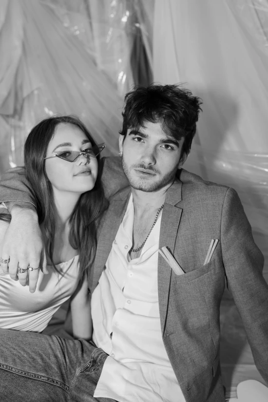 a black and white photo of a man and a woman, unsplash, photorealism, joey king, lizard king / queen forgiveing, mark edward fischbach, in style of petra collins