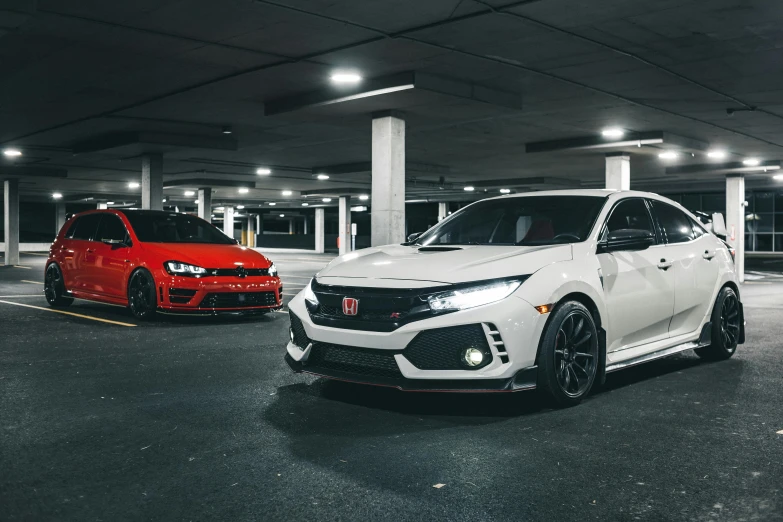 two cars parked in a parking lot next to each other, a portrait, pexels contest winner, honda civic, white and red body armor, indoor picture, replicas