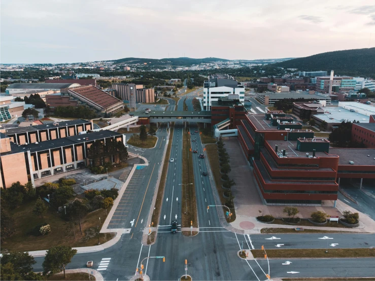 an aerial view of a city at dusk, by Carey Morris, pexels contest winner, happening, southdale center, split near the left, maroon, student