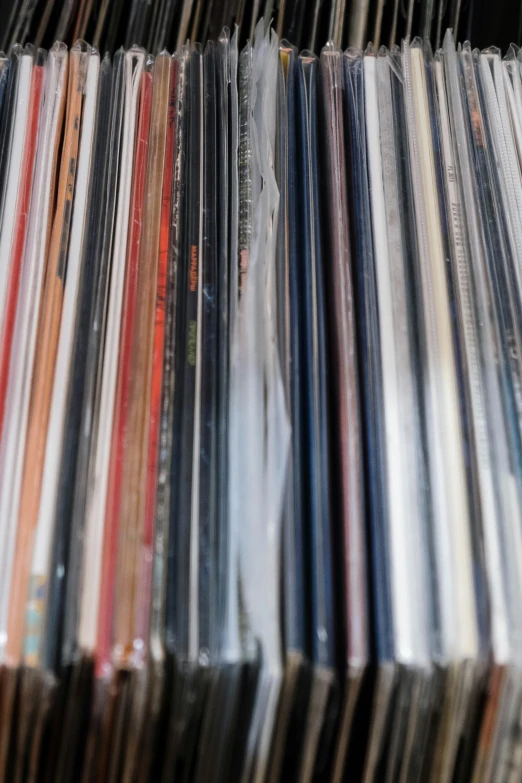 a bunch of cds stacked on top of each other, an album cover, by Doug Ohlson, unsplash, purism, reggae, soft vinyl, really long, zoomed in